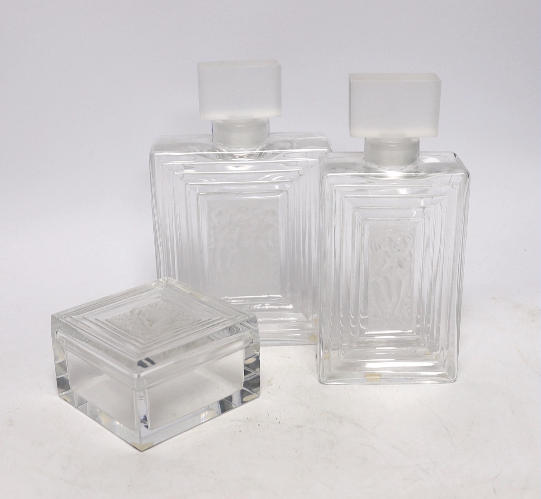 Two Lalique Duncan pattern glass scent bottles and stoppers and a matching toilet box and cover, tallest 20cm